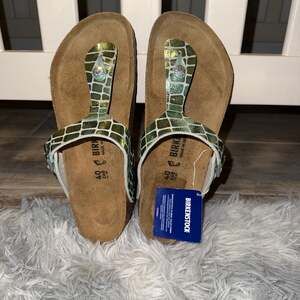 Birkenstock Arizona Gator Gleam Green Two-Strap Sandals